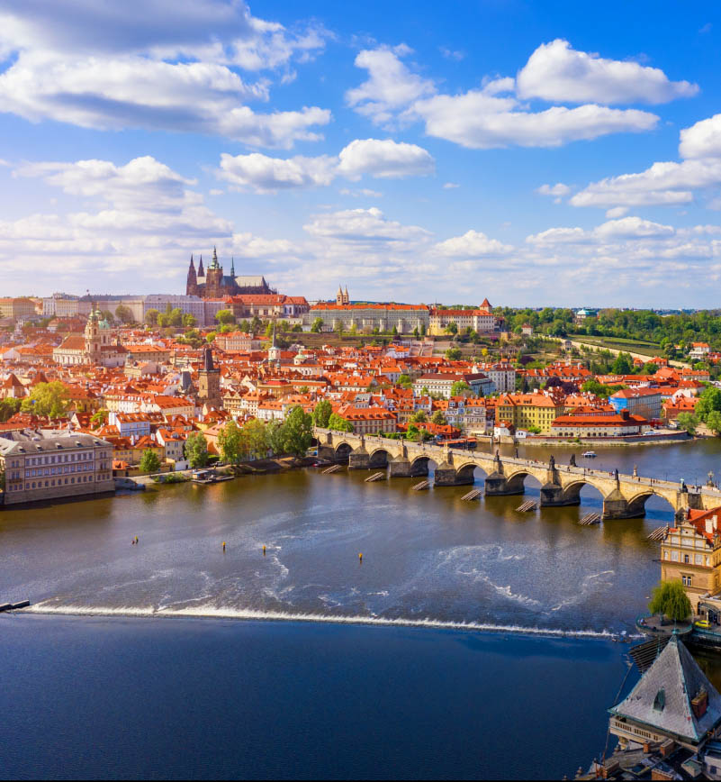 A collage of photographs of Prague with a drawing of a waving hand and a funny rooster with a phone made of a tin can and wire.